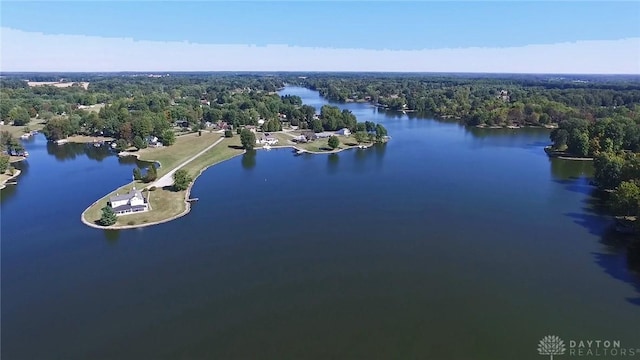 aerial view with a water view and a forest view