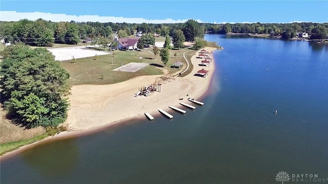 aerial view featuring a water view and a view of trees