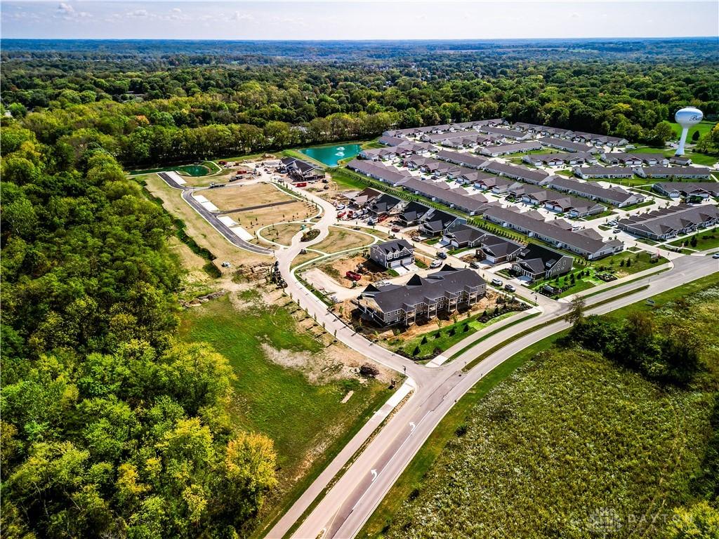 4206 N Golden Clove Bnd Unit 55-303, Sugarcreek Township, OH 45459 - bird's eye view featuring a view of trees