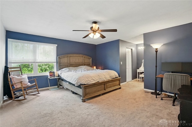 bedroom featuring baseboards, ceiling fan, and carpet floors