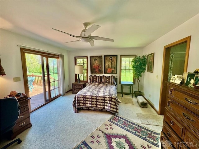 bedroom featuring ceiling fan, carpet, and access to outside