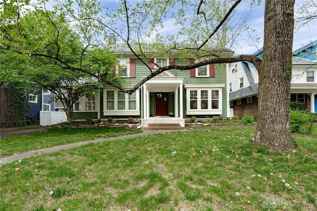 825 Far Hills Ave, Oakwood, OH 45419 - view of front of home featuring a front lawn and a chimney