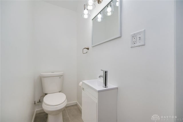 825 Far Hills Ave, Oakwood, OH 45419 - half bath with tile patterned flooring, baseboards, toilet, and vanity