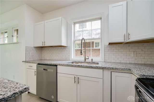 825 Far Hills Ave, Oakwood, OH 45419 - kitchen featuring stainless steel appliances, a sink, white cabinetry, and light stone counters