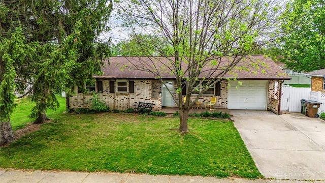 1579 Commonwealth Dr, Xenia, OH 45385 - view of front of house with brick siding, driveway, and an attached garage