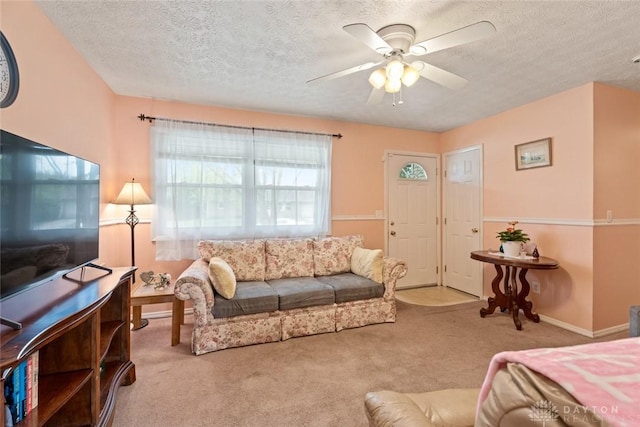 1579 Commonwealth Dr, Xenia, OH 45385 - carpeted living area featuring a ceiling fan and a textured ceiling
