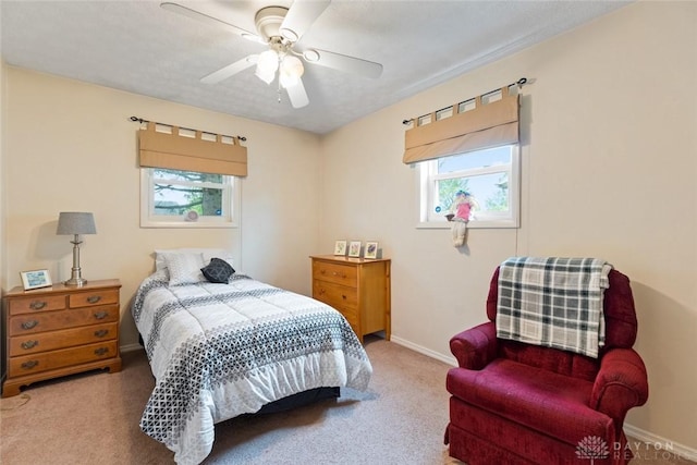 bedroom with carpet floors, baseboards, and a ceiling fan