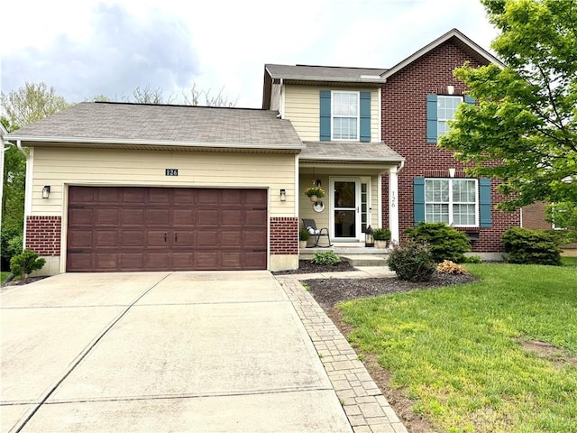 traditional-style house featuring concrete driveway, an attached garage, a front lawn, and brick siding