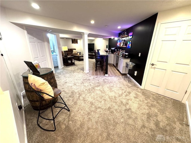office space with light colored carpet, a dry bar, and recessed lighting