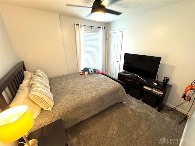 carpeted bedroom with a ceiling fan