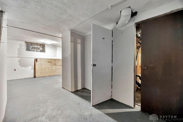 below grade area with a textured ceiling