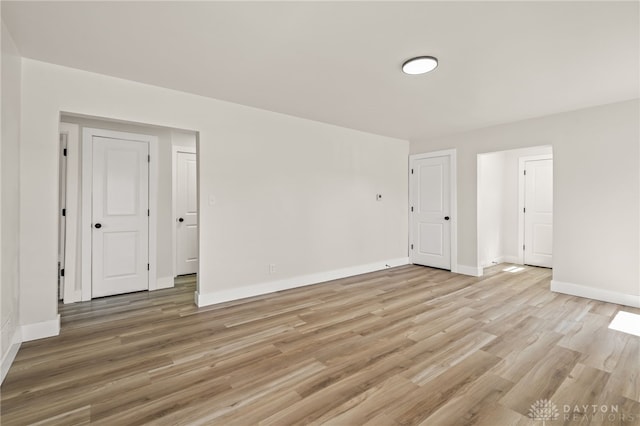 709 E Dorothy Ln, Dayton, OH 45419 - empty room with light wood-style floors and baseboards
