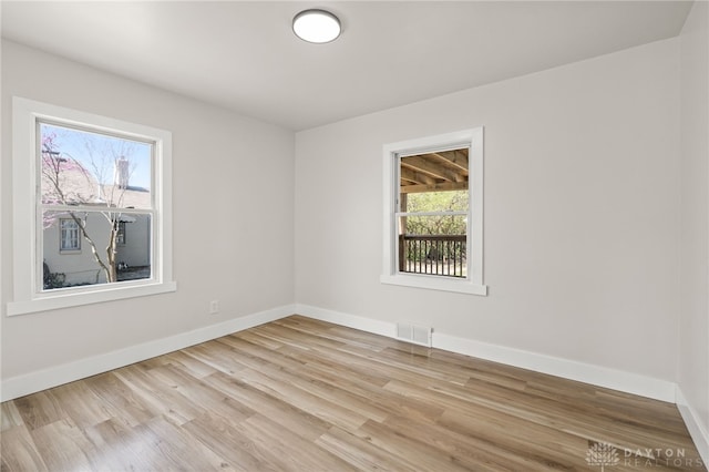 709 E Dorothy Ln, Dayton, OH 45419 - unfurnished room featuring baseboards, visible vents, and light wood-style floors