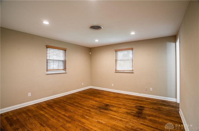 5149 Marshall Rd, Washington Twp, OH 45429 - empty room featuring baseboards, plenty of natural light, dark wood-type flooring, and recessed lighting