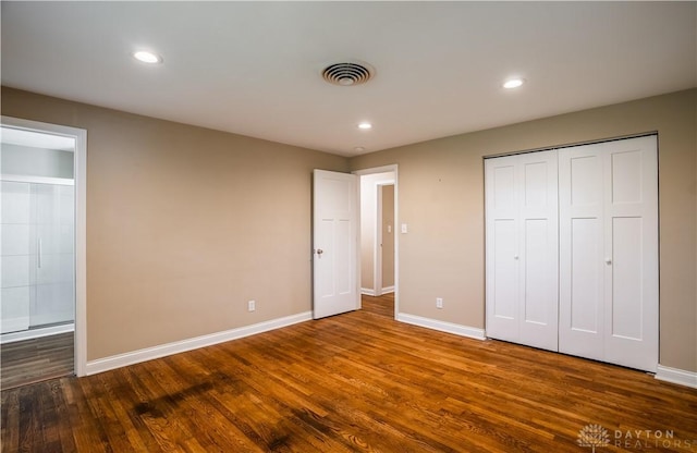 5149 Marshall Rd, Washington Twp, OH 45429 - unfurnished bedroom with dark wood-style floors, baseboards, recessed lighting, and a closet