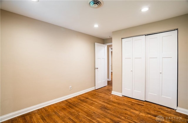 5149 Marshall Rd, Washington Twp, OH 45429 - unfurnished bedroom with baseboards, wood finished floors, recessed lighting, and a closet