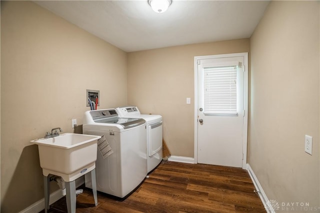 5149 Marshall Rd, Washington Twp, OH 45429 - laundry room with dark wood finished floors, washer and dryer, and baseboards