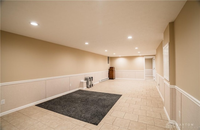5149 Marshall Rd, Washington Twp, OH 45429 - finished below grade area featuring a baseboard radiator, a decorative wall, a wainscoted wall, recessed lighting, and tile patterned floors