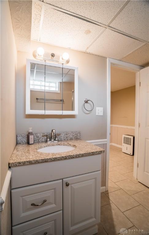 5149 Marshall Rd, Washington Twp, OH 45429 - bathroom with vanity, tile patterned floors, and a paneled ceiling