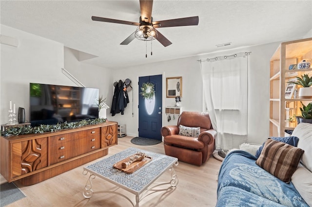 784 Marshall Dr, Xenia, OH 45385 - living area featuring wood finished floors, a ceiling fan, and a textured ceiling