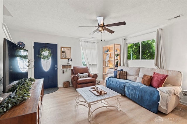 784 Marshall Dr, Xenia, OH 45385 - living room with light wood-type flooring, a ceiling fan, and a textured ceiling