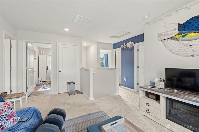 784 Marshall Dr, Xenia, OH 45385 - living area featuring carpet flooring, baseboards, recessed lighting, and attic access