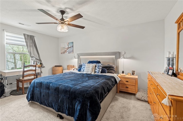 784 Marshall Dr, Xenia, OH 45385 - bedroom featuring light carpet, ceiling fan, and a textured ceiling
