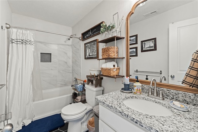 784 Marshall Dr, Xenia, OH 45385 - bathroom with vanity, shower / bath combo with shower curtain, toilet, and a textured ceiling