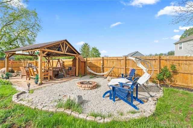 784 Marshall Dr, Xenia, OH 45385 - fenced backyard with an outdoor fire pit, a gazebo, and a patio