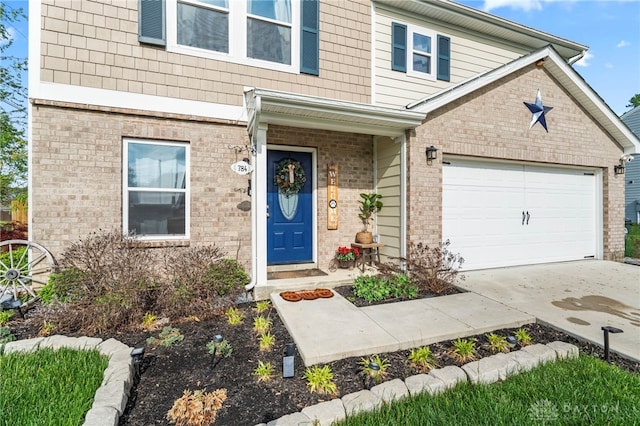 784 Marshall Dr, Xenia, OH 45385 - view of front of house with brick siding, a garage, and driveway