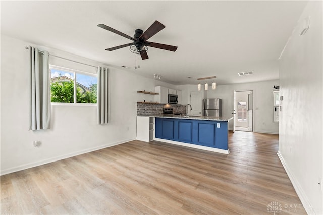 784 Marshall Dr, Xenia, OH 45385 - kitchen with appliances with stainless steel finishes, light wood-type flooring, open shelves, blue cabinets, and a ceiling fan