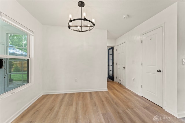 784 Marshall Dr, Xenia, OH 45385 - unfurnished dining area featuring a chandelier and light wood-type flooring
