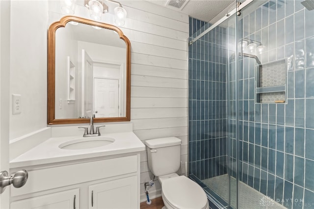 784 Marshall Dr, Xenia, OH 45385 - bathroom featuring vanity, a tile shower, and wooden walls