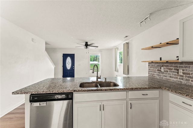 784 Marshall Dr, Xenia, OH 45385 - kitchen with stainless steel dishwasher, open shelves, a peninsula, white cabinetry, and a ceiling fan