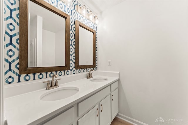 784 Marshall Dr, Xenia, OH 45385 - full bathroom featuring double vanity and baseboards