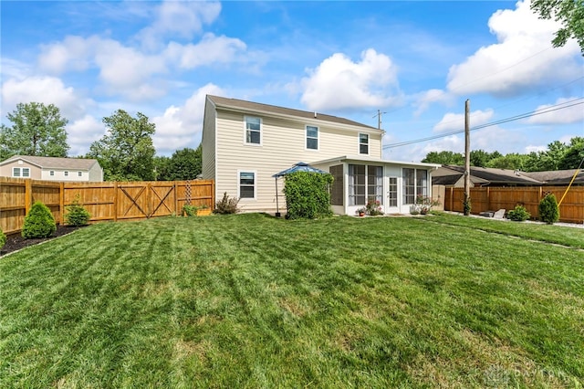 784 Marshall Dr, Xenia, OH 45385 - back of property featuring a fenced backyard and a sunroom