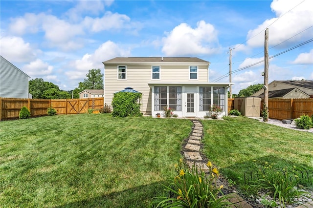 784 Marshall Dr, Xenia, OH 45385 - rear view of house with a sunroom, a shed, and a fenced backyard