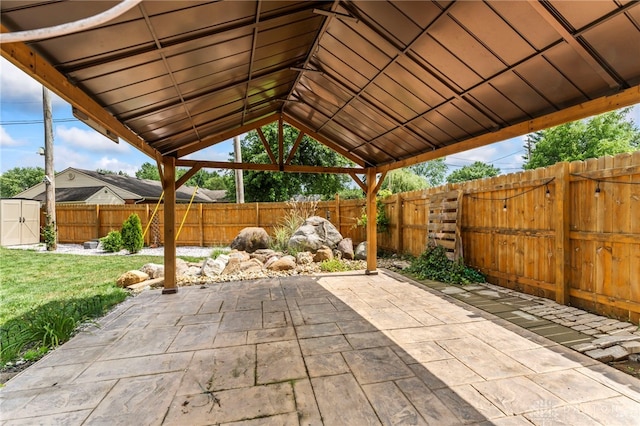 784 Marshall Dr, Xenia, OH 45385 - fenced backyard with a patio area and a storage shed