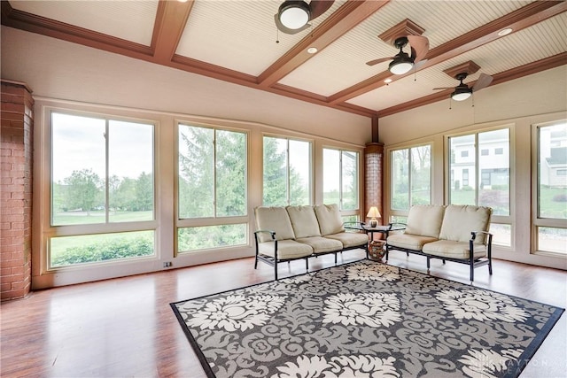 sunroom with vaulted ceiling with beams and wood finished floors