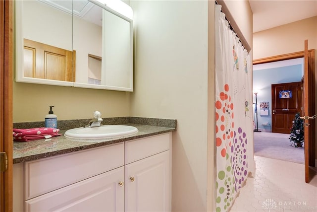 full bath with tile patterned floors, a shower with shower curtain, and vanity