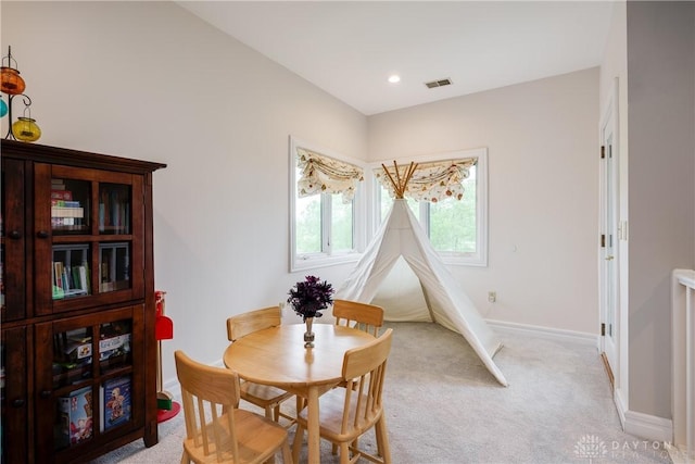 dining room with baseboards, recessed lighting, visible vents, and light colored carpet