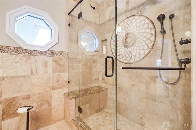 full bathroom with a shower stall