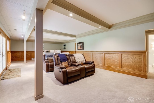 living room featuring a wainscoted wall, light carpet, ornamental molding, and recessed lighting