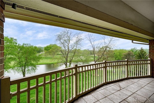 balcony featuring a water view
