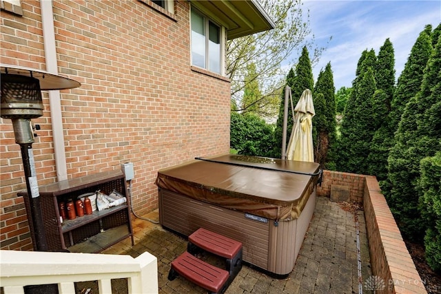 view of patio / terrace featuring a hot tub