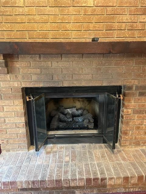 details featuring a brick fireplace