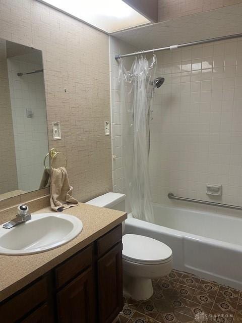 bathroom with toilet, shower / tub combo with curtain, tile patterned floors, and vanity