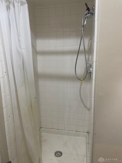 full bath featuring a shower stall