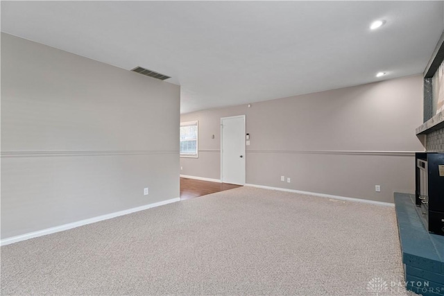 1824 Scotch Pine Dr, Beavercreek, OH 45432 - unfurnished living room with a fireplace, carpet floors, visible vents, baseboards, and recessed lighting
