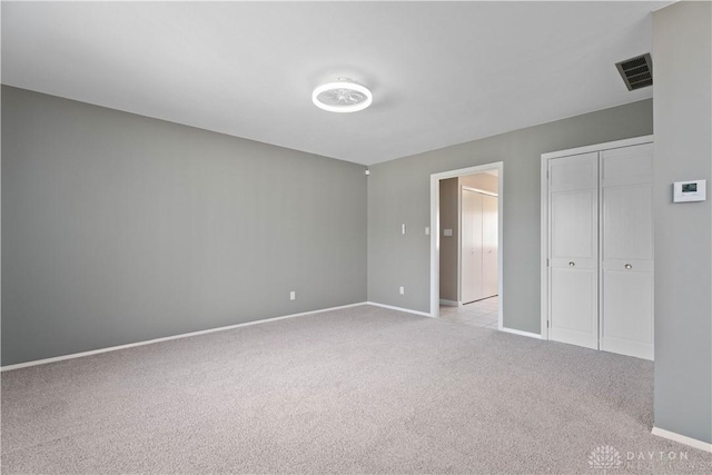 1824 Scotch Pine Dr, Beavercreek, OH 45432 - unfurnished bedroom featuring light colored carpet, baseboards, a closet, and visible vents